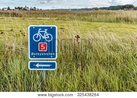 Sign Showing The Bicycle Path Along The East Coast Of Denmark, Holl, Denmark, September 3, 2019