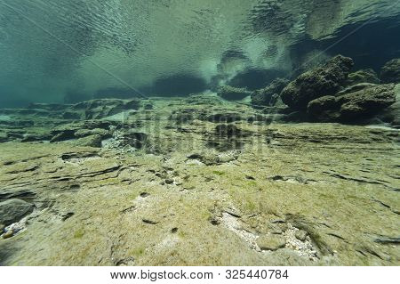 Rocks Underwater On Riverbed With Clear Freshwater. Underwater Landscape. Traun River. Freshwater Wo