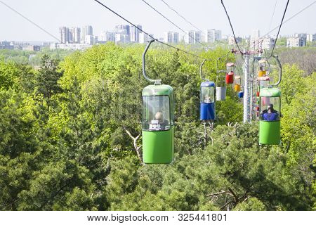 Kharkov, Ukraine - April 30, 2018: Lots Of Colourful Cabins On Rope In The City Park. Panorama Of Ca