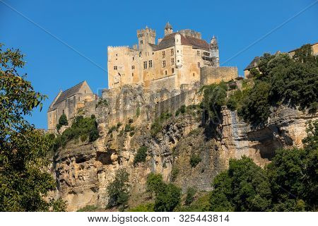 The Medieval Chateau De Beynac Rising On A Limestone Cliff Above The Dordogne River. France, Dordogn
