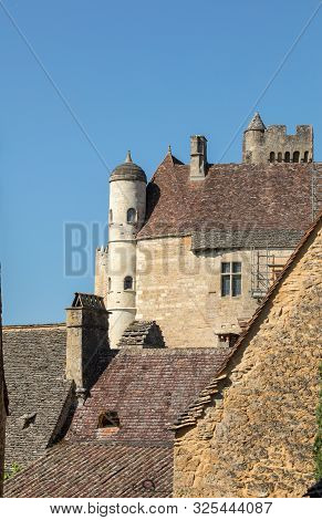 The Medieval Chateau De Beynac Rising On A Limestone Cliff Above The Dordogne River. France, Dordogn