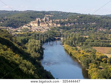 The Medieval Chateau De Beynac Rising On A Limestone Cliff Above The Dordogne River Seen From Castel