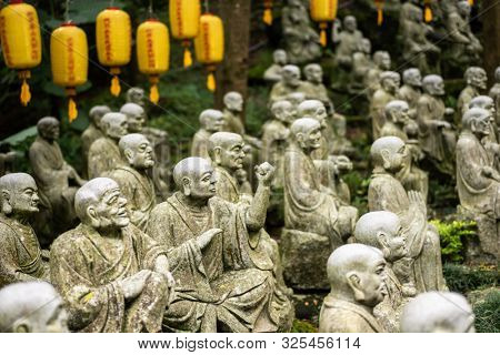 groups of buddhist arhat stone statue in the garden