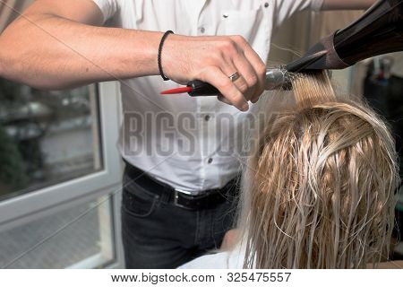 Young Blonde Attractive Woman At Hairdresser. Health And Beauty. Close-up Of Wet Gray Silver Hair Dr