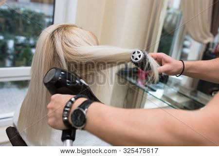 Young Beauty Blonde Attractive Woman At Hairdresser. Close-up Of Gray Silver Platinum Comb Hair Drye
