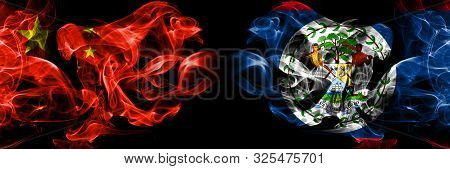 China Vs Belize, Belizean Smoke Flags Placed Side By Side. Thick Colored Silky Smoke Flags Of Chines