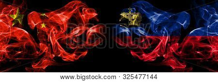 China Vs Liechtenstein, Liechtensteins Smoke Flags Placed Side By Side. Thick Colored Silky Smoke Fl