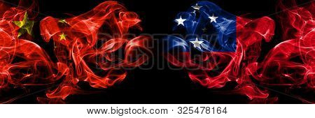 China Vs Samoa, Samoan Smoke Flags Placed Side By Side. Thick Colored Silky Smoke Flags Of Chinese A