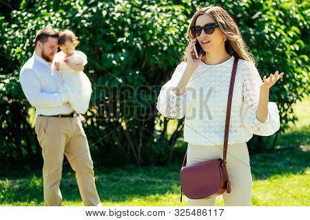 Rich And Beautiful Woman Cagy Stylish Sunglasses Talking On The Phone With Her Lover Paramour On The
