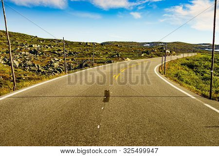 Road Crossing Hardangervidda Plateau, Norway Landscape. National Tourist Hardangervidda Route.