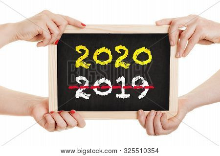 Women Holding Chalkboard Isolated On White Background. New Year 2020 Concept.
