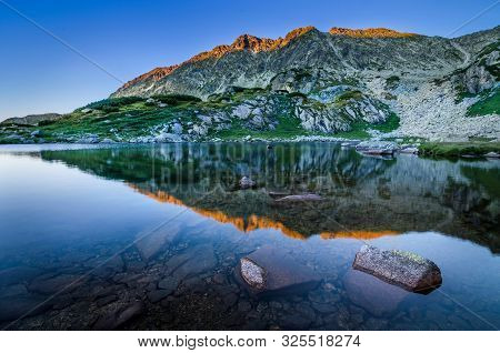 Mountain Landscape And Glacial Taul Portii Lake In Retezat National Park, Carpathian Mountains, Roma