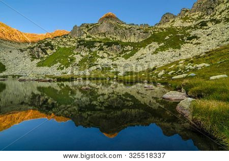 Mountain Landscape And Glacial Taul Portii Lake In Retezat National Park, Carpathian Mountains, Roma