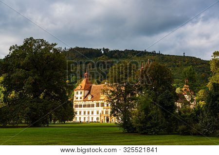 View At Eggenberg Palace In Autumn Tourist Spot, Famous Travel Destination In Styria.