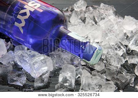 Cold Bottles Of Skyy Vodka On The Ice Cubes, Night Party