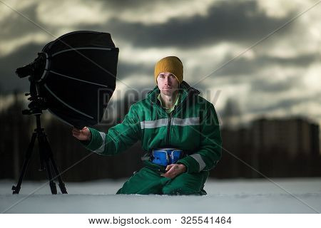 The Photographer Takes Autoportrait Remotely On The Meadow. Outside.