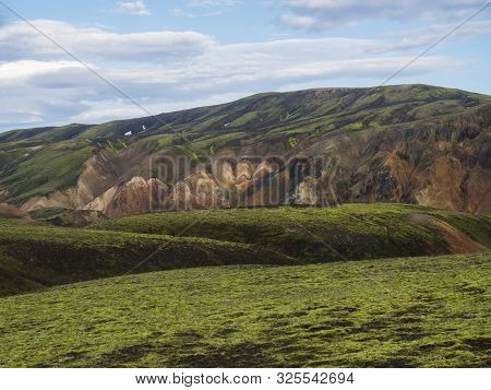Green Meadow With Colorful Rhyolit Mountain Panorma With Multicolored Volcanos In Landmannalaugar Ar