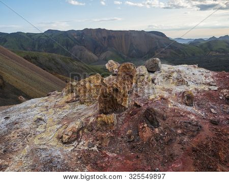 Colorful Rhyolit Red And Orange Fumarole At Foot Of Brennisteinsalda Mountain With Panorma Of Landma