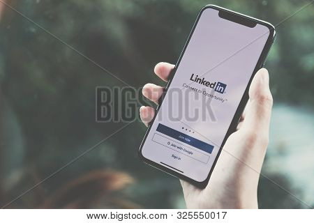 Chiangmai, Thailand - Jun, 22 ,2019 : Woman Holding A Iphone X With Social Network Service Linkedin 