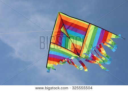 Big Kite With Vivid Colors On Blue Sky Without People