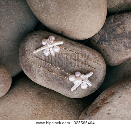 Beautiful Stud Earrings On The Stone. Stock Photo