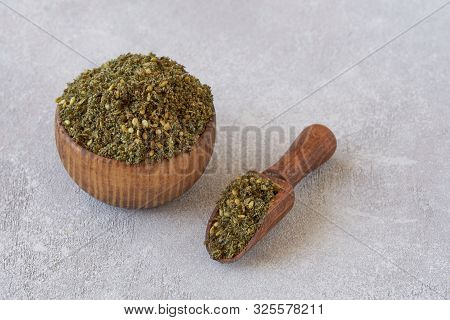 Mixed Spice Zaatar Or Zatar In Wooden Bowl On Light Stone Background