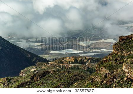 Aerial View Of Green Mountains And Southern Coast Of Tenerife From Macizo De Adeje. Warm Sunny Day A