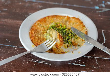 Delicious Traditional Turkish Dessert:  Kunefe  Kadayif With Pistachio And Cheese