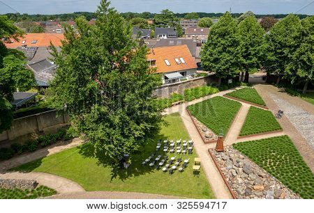 Aerial Top Down View . Beautiful Daytime View From Castle. Small Lake Landscape View. Castle With Ga