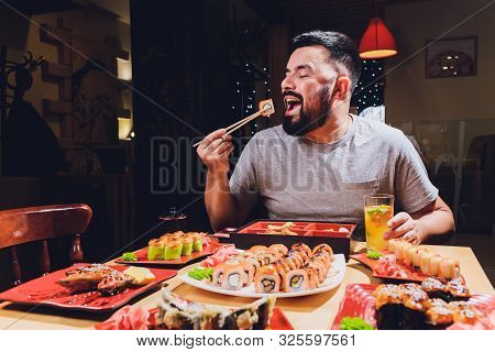 Tourist Man Eating Asian Food Street Local Cafe, Smile Using Chopstick.