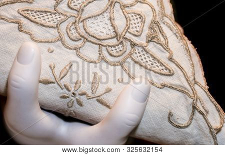 Napkin Holder In Shape Of Fingers With Stitched Napking.  Funny Concept Slanted On Black Background
