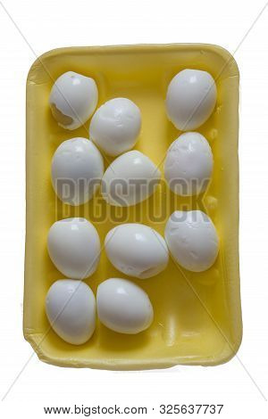 Peeled Eggs Lie In A Yellow Packing Box, A Meager Breakfast On A White Background, Isolated