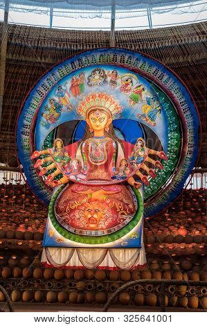 Goddess Durga Idol At Decorated Durga Puja Pandal, Shot At Colored Light, At Kolkata, West Bengal, I