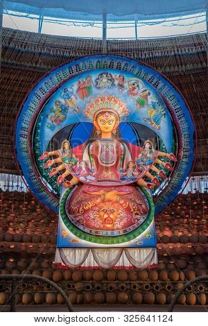 Goddess Durga Idol At Decorated Durga Puja Pandal, Shot At Colored Light, At Kolkata, West Bengal, I