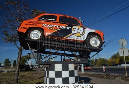 
Old Soviet car ZAZ-965 (Zaporozhets) used as a billboard. October 2, 2019. Kiev, Ukraine