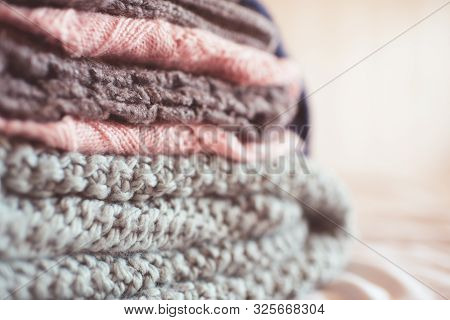 Colorful Knitted Clothes Floded Closeup. Winter Season. Selective Focus.