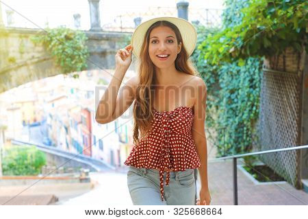 Young Attractive Cheerful Woman Walking In Old Italian City.