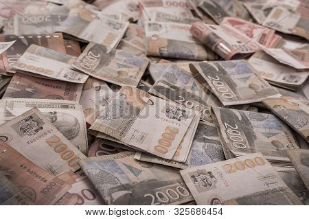 Money Bills Stacked Over Each Other Forming A Money Background