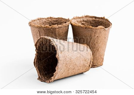 Pots For Seedlings Of Ecological Cardboard. Peat Seed Pots. Pots On Isolated White Background