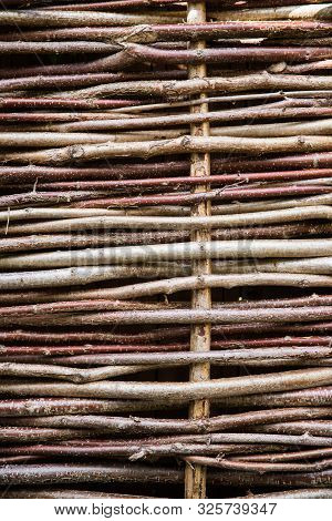 A Full Frame Background Of A Close Up Of Willow Or Hazel Tree Hurdle Fencing With Copy Space