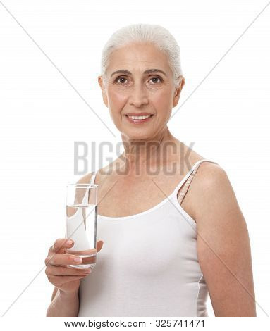 Portrait Of Beautiful Mature Woman With Glass Of Water On White Background