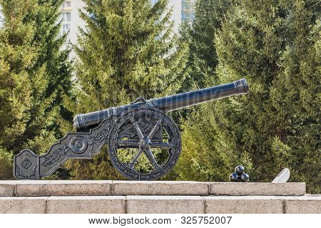 Yekaterinburg, Sverdlovsk Russia - 04 11 2019: A Beautiful Cast-iron Black Antique Cannon With Three
