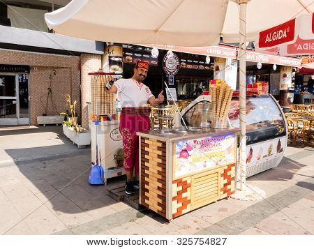 Antalya, Turkey - February 24, 2019: Ice Cream Seller Invites Buyers Ice Cream In The Fast Food Kios