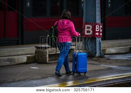 Woman Carrying A Luggage On The Platform Of Bucharest North Railway Station (gara De Nord Bucuresti)