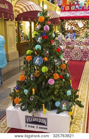 Moscow, Russia - December 2, 2018: Christmas Trees With Symbols Of Various Companies In Gum. Christm