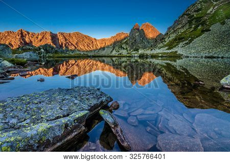 Mountain Landscape And Glacial Taul Portii Lake In Retezat National Park, Carpathian Mountains, Roma
