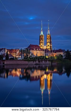 Cathedral Of St. John The Baptist Reflecting In Oder River, Wroclaw, Poland
