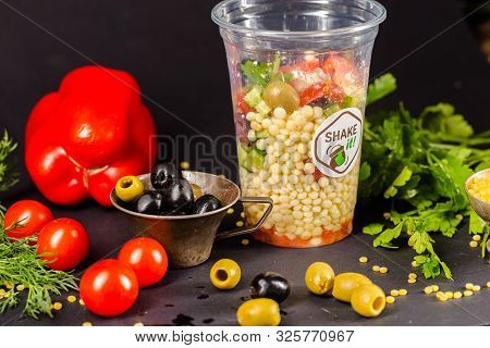 Russia St. Petersburg Greenbox 01102019 Italian Salad With Olives, Cereals, In A Plastic Container, 