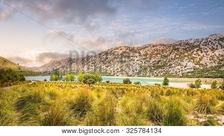 Embassament De Cuber Is An Artificial Turquoise Colour Lake, Water Reservoir, Located At The Valleys