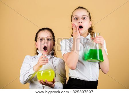 Knowledge Day. Schoolgirls Friends With Chemical Liquids. Childhood And Upbringing. Knowledge And In